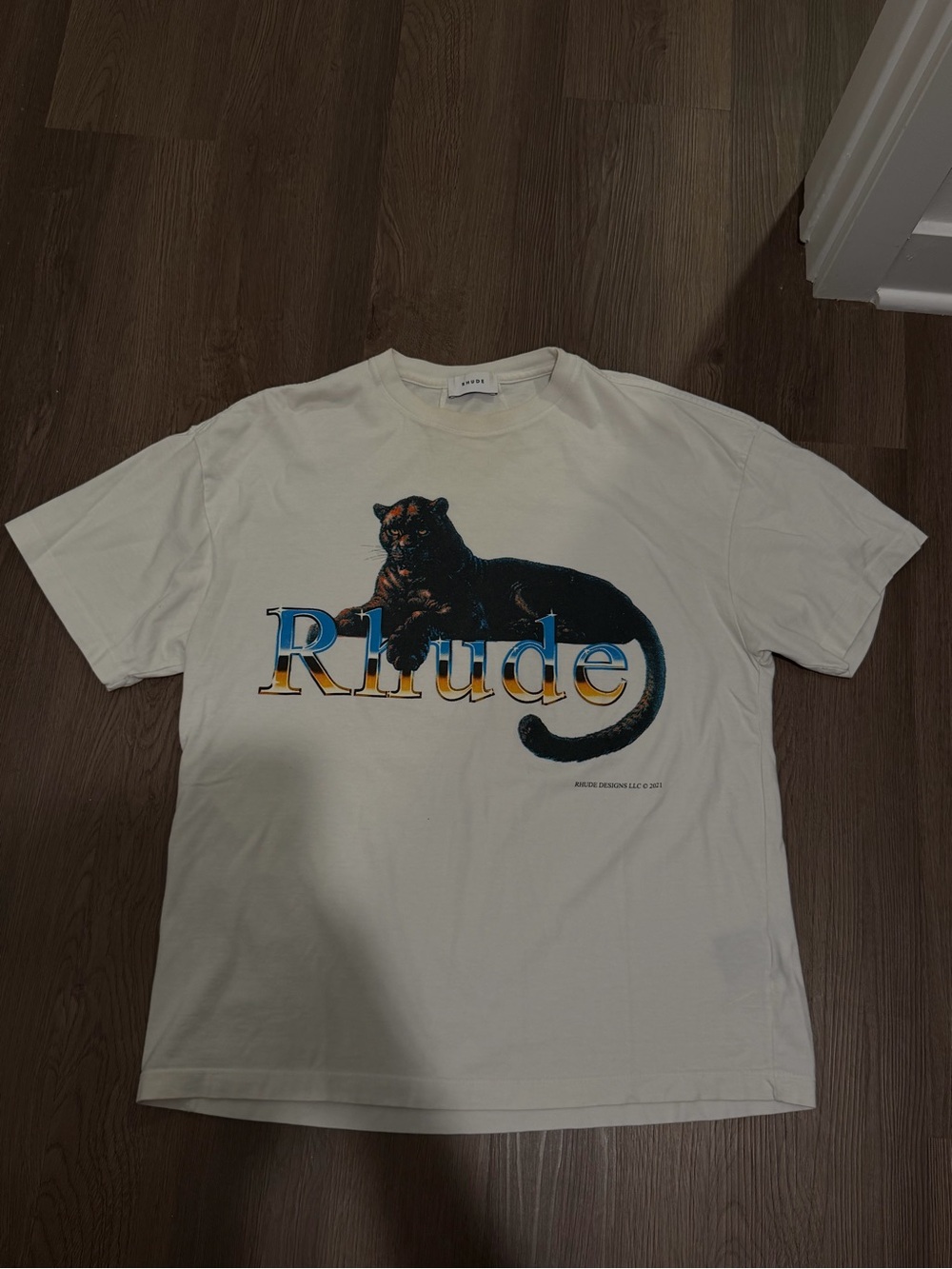 Rhude Cream Graphic Panther Logo T-Shirt with Blue and Black Print